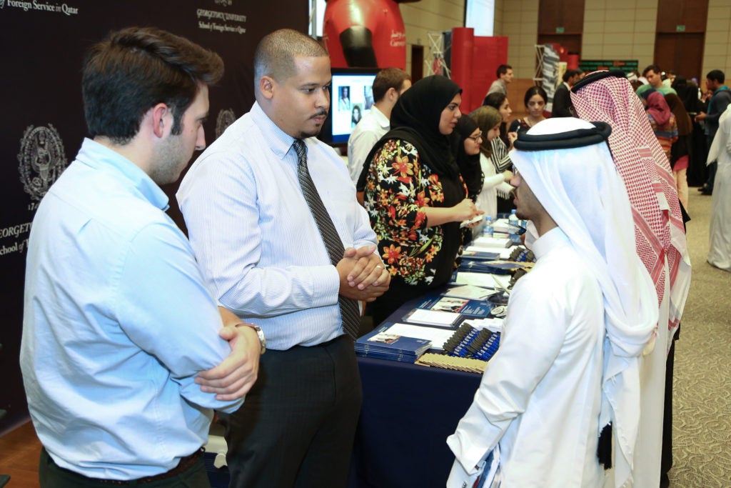 High school students speaking to admission team