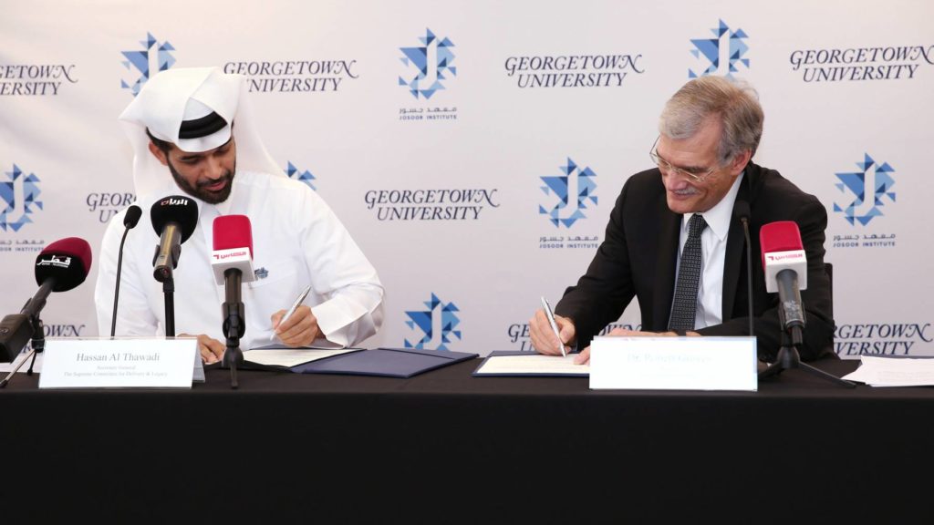 Dr. Robert M. Groves and Mr. Hassan Al Thawadi Signing the Agreement