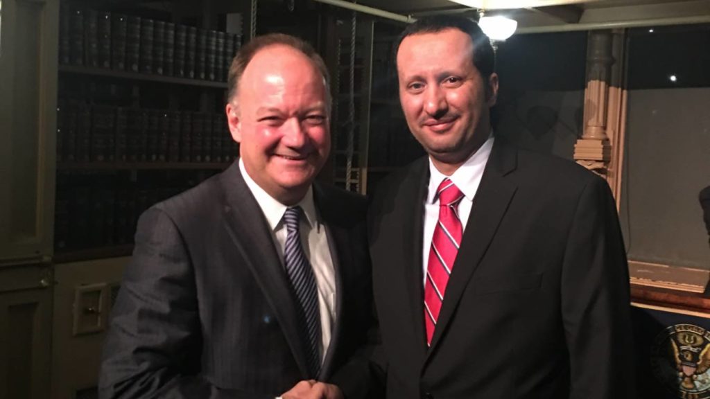 Omar Al Swadi with Georgetown University President John J. DeGioia