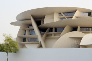 A part of the museum is in view with its interesting architecture that folds over one another like the desert rose.