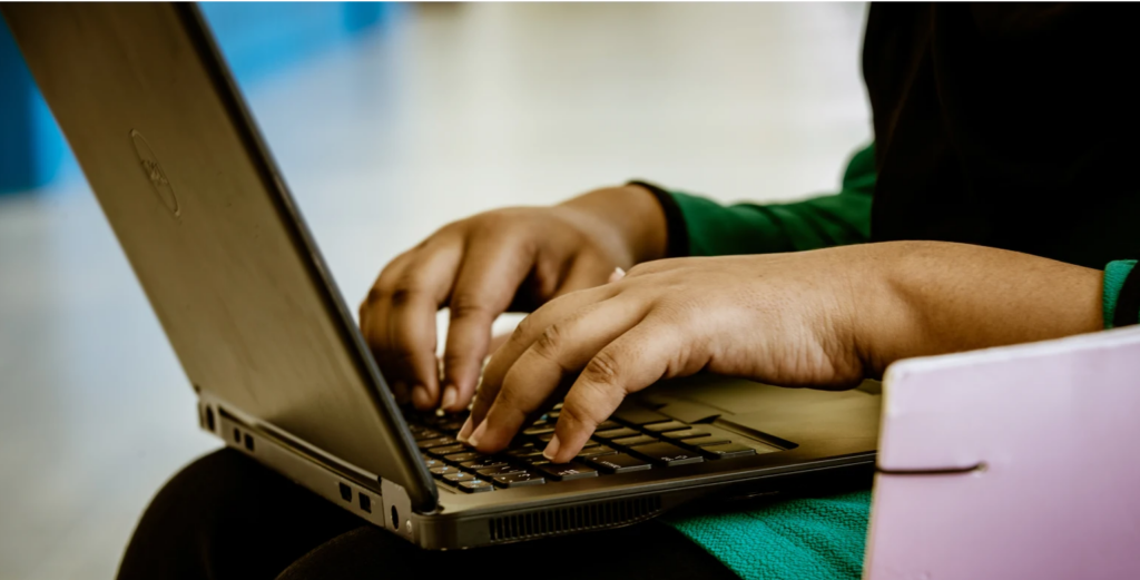image of a person using a laptop