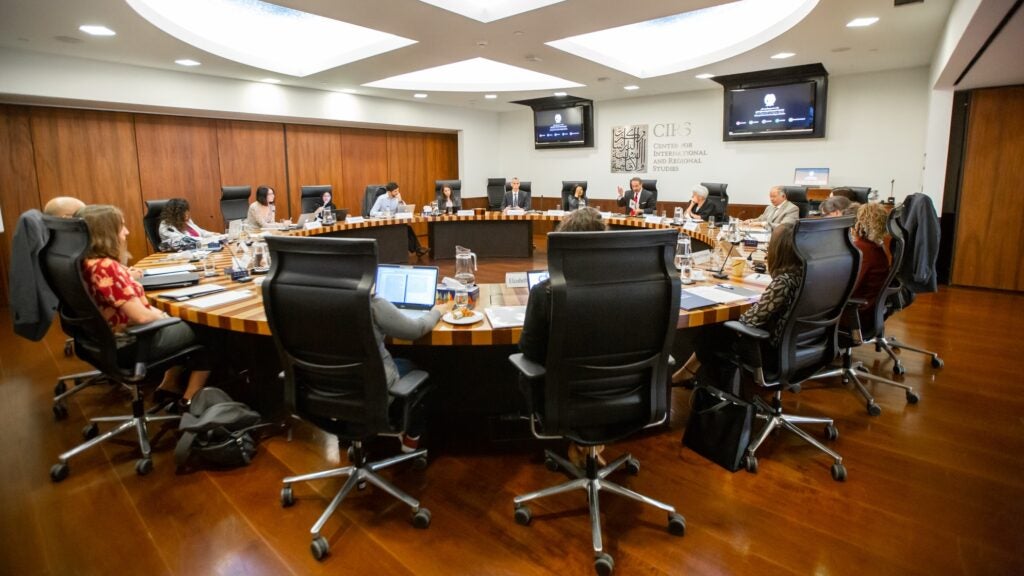 People sitting around a table at the Center for International and Regional Studies