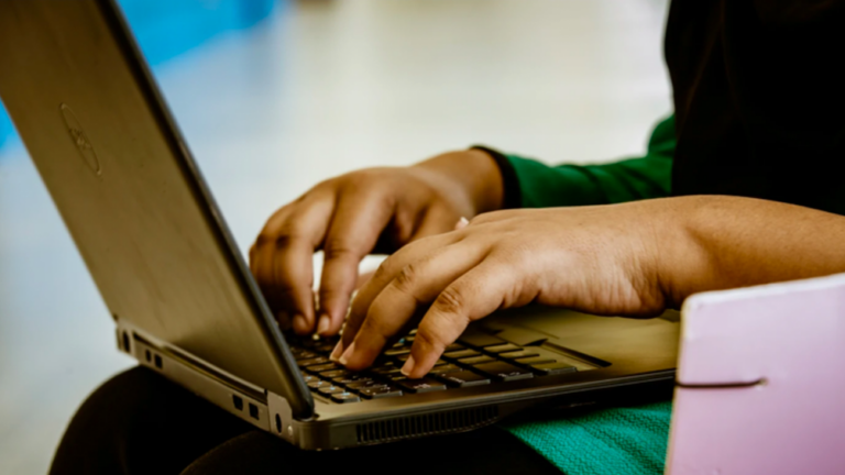 Student uses accessibility tools on a laptop.