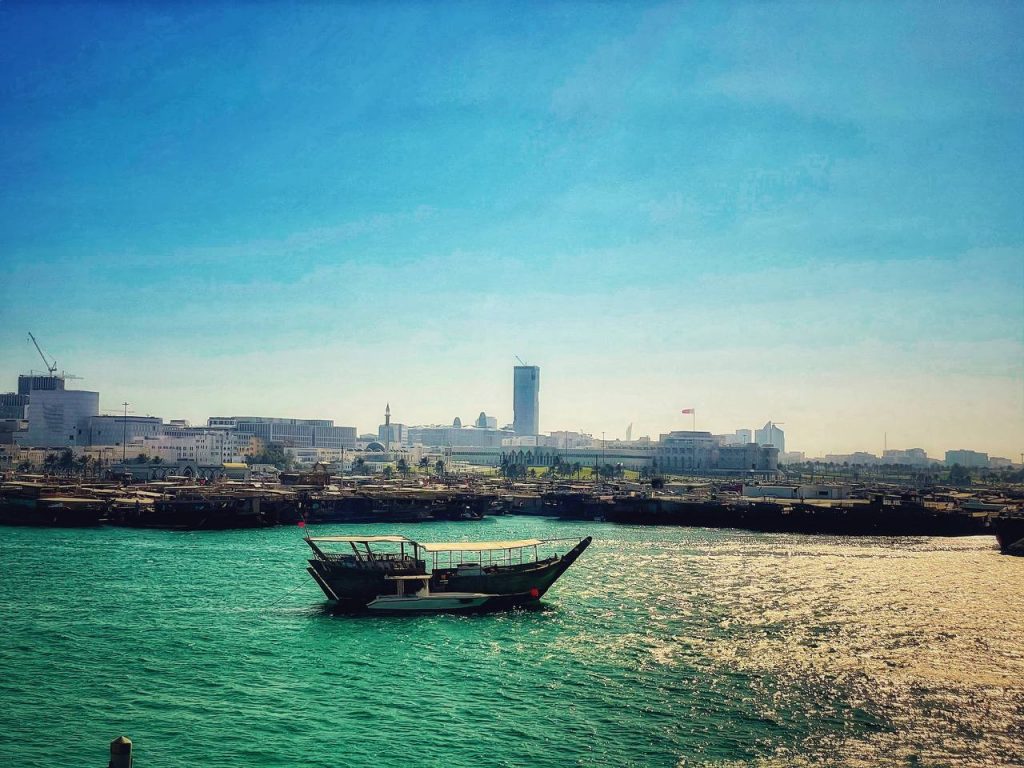 A boat sailing across Corniche