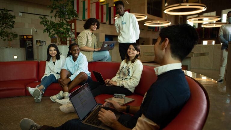 Students in the GU-Q atrium