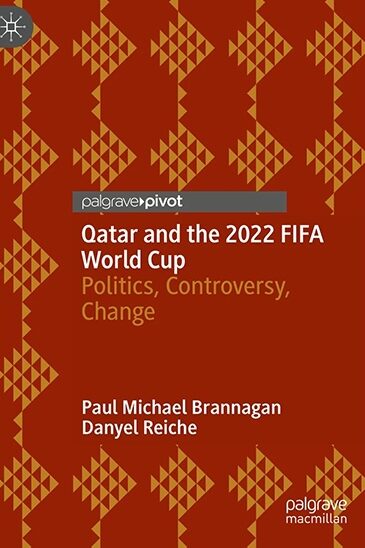 red book with writing that says Qatar and the 2022 FIFA World