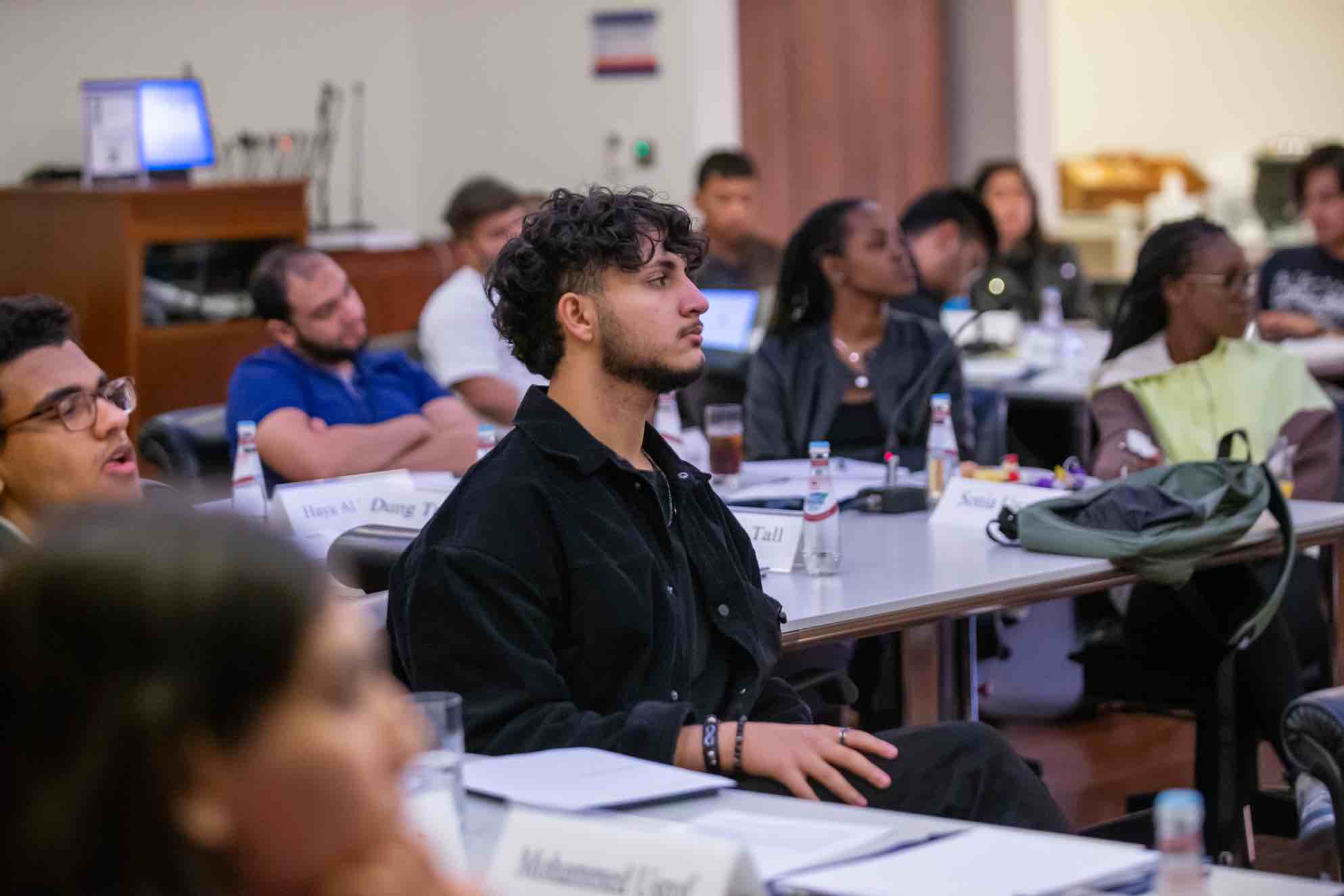 Students sitting around a table in class