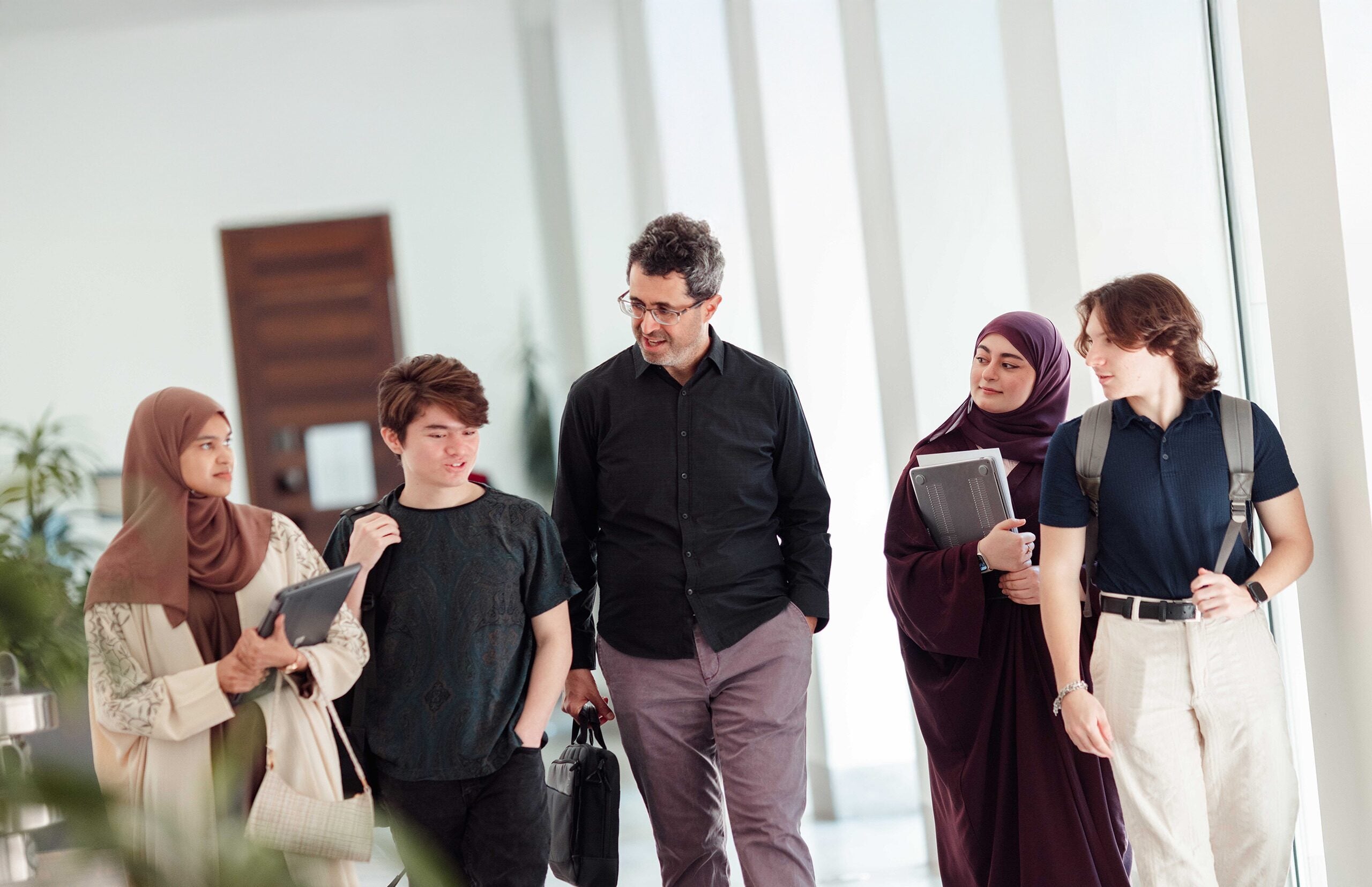 v2Students Walking with Professor at GUQatar
