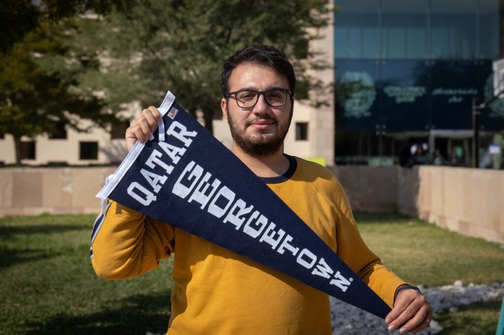 Image of Aras in front of the Georgetown Qatar building